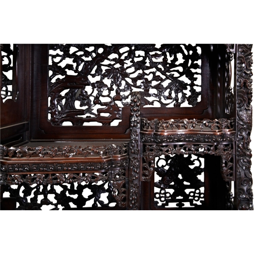 454 - AN IMPRESSIVE CARVED 'ZITAN' HARDWOOD DISPLAY CABINETQING DYNASTY, 19TH CENTURY紫檀博古架 清 19世纪the cabin... 