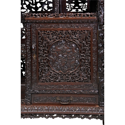 454 - AN IMPRESSIVE CARVED 'ZITAN' HARDWOOD DISPLAY CABINETQING DYNASTY, 19TH CENTURY紫檀博古架 清 19世纪the cabin... 