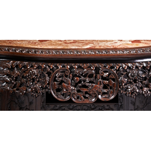 457 - A CARVED HUALI-WOOD SECRETAIRE SIDE CABINETMID-QING PERIOD 清中期 花梨柜the serpentine shaped top inset wi... 