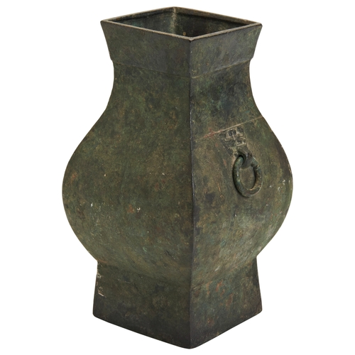 43 - AN ARCHAISTIC BRONZE VASE, HULATE MING DYNASTY, 17TH CENTURY铜饕餮耳方壶 晚明the square section baluster sid... 