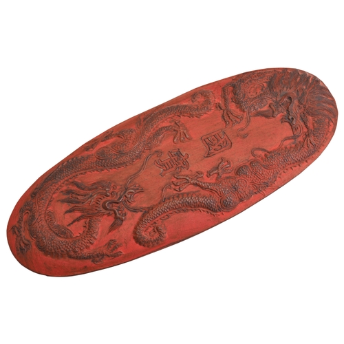 392 - A RED INK CAKEQING DYNASTY 18TH/19TH CENTURY朱砂墨饼 清 18/19世纪with apocryphal Xuande mark12.8cm longPROV... 