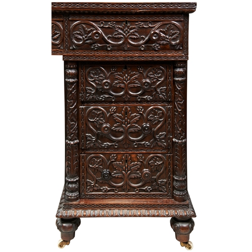 484 - A GOOD ANGLO-INDIAN CARVED PADOUK PEDESTAL DESK19TH CENTURY the sides finely carved with an all desi... 