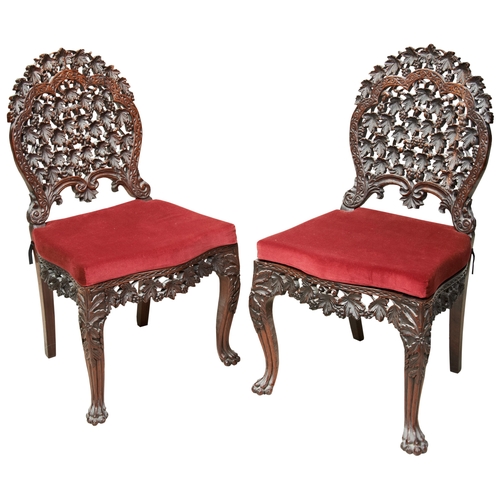 485 - A PAIR OF ANGLO-INDIAN CARVED HARDWOOD SIDE CHAIRS19TH CENTURYthe pierced shaped back carved through... 