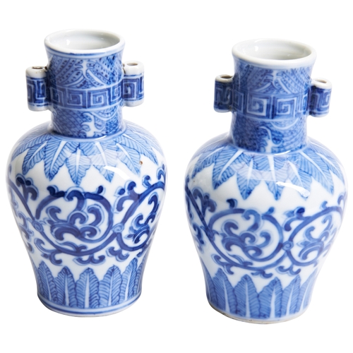 91 - A PAIR OF BLUE AND WHITE MING-STYLE VASESQING DYNASTY, 18TH / 19TH CENTURY青花缠枝莲贯耳瓶一对 清 18/19世纪the ba... 