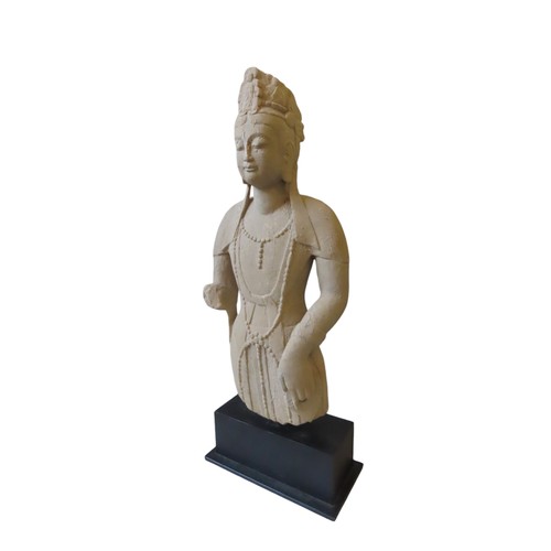 311 - A CHINESE SANDSTONE MODEL OF A  BODDHISATTVA, 20TH CENTURY, raised on a rectangular plinth base59 cm... 