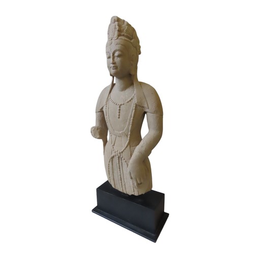 311 - A CHINESE SANDSTONE MODEL OF A  BODDHISATTVA, 20TH CENTURY, raised on a rectangular plinth base59 cm... 