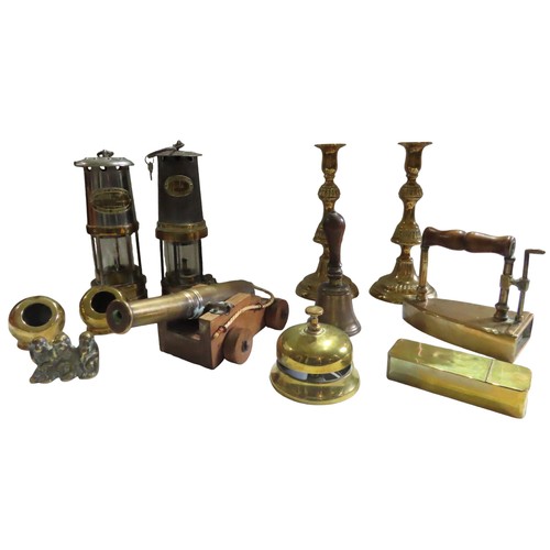 732 - TWO MINER'S LAMPS AND A PAIR OF BRASS CANDLESTICKS, together with a mixed group of brass ornaments i... 