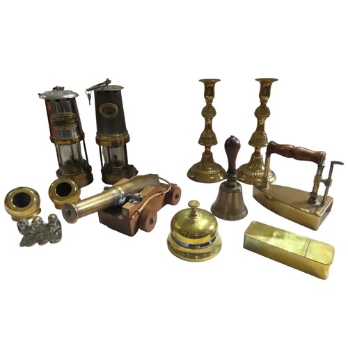 732 - TWO MINER'S LAMPS AND A PAIR OF BRASS CANDLESTICKS, together with a mixed group of brass ornaments i... 