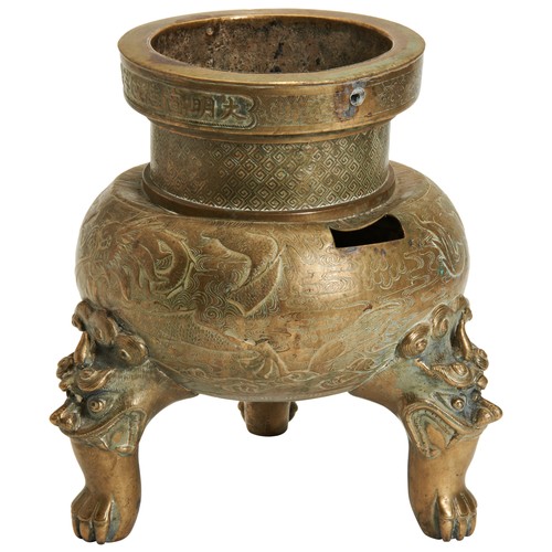 52 - A BRONZE TRIPOD CENSER XUANDE MARK, 17/18 CENTURY ‘宣德年制’兽面三足铜炉 17/18世纪25cm High The body is carved w... 