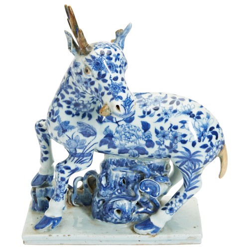 53 - A MING-STYLE BLUE AND WHITE DEER FIGURE19TH CENTURY青花鹿型瓷塑  19世纪decorated throughout in tones of unde... 