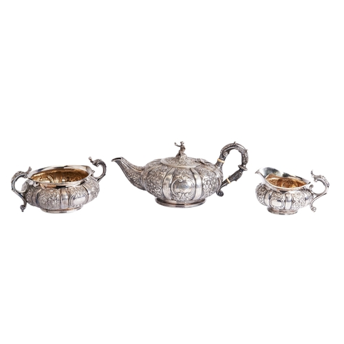 56 - THREE PIECE SILVER TEA SET, ROBERT HENNELL LONDON 1822 The lobed bodies chased with flowers and shel... 