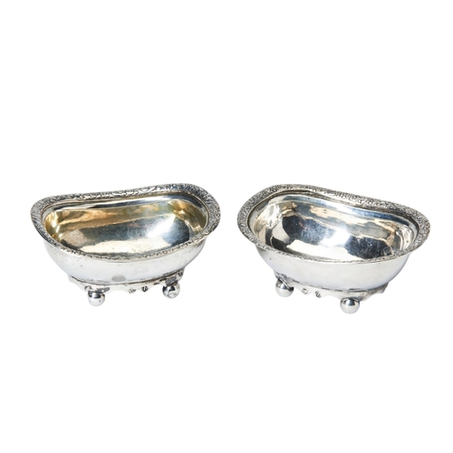 6 - PAIR OF COLONIAL SALT CELLARS, UNASCRIBED C.1820 With applied florate rims on four ball feet. Marked... 