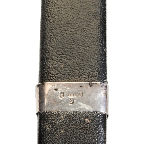 19 - AN EDWARDIAN SCOTTISH MILITARY DIRK, of typical form in a leather case, the case and handles with si... 