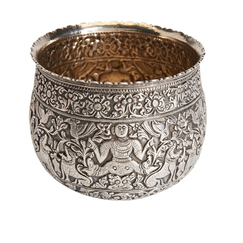 A HEAVY CHASED BOWL, SRI LANKA C.1890. Decorated all over with traditional masks, lions, deities and foliage.