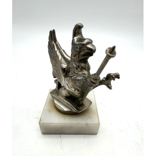 113 - A VAUXHALL 'WYVERN' STYLE MASCOTSolid nickel with staff, 8cm high plus marble base.