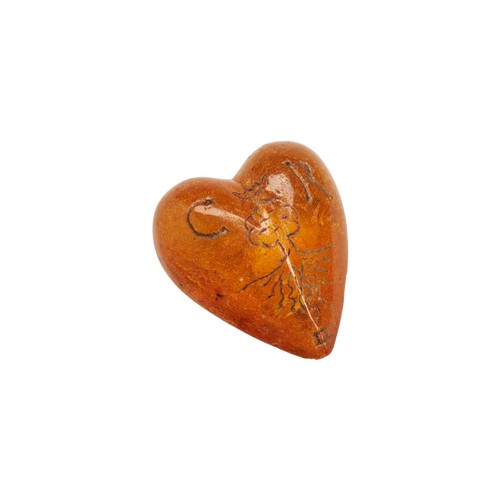 38 - A CHARLES II CARVED AMBER HEART C.1672. The transparent amber is inscribed on one side with the Cyph... 