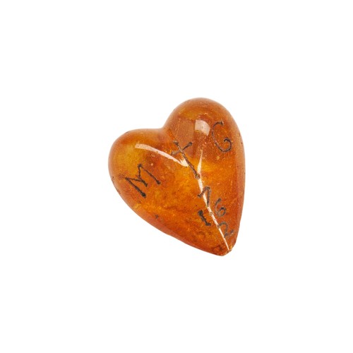 38 - A CHARLES II CARVED AMBER HEART C.1672. The transparent amber is inscribed on one side with the Cyph... 