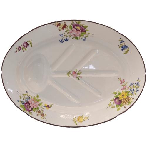 182 - A PEARLWARE MEAT PLATECIRCA 1820Painted with floral springs and with moulded well. 45cms