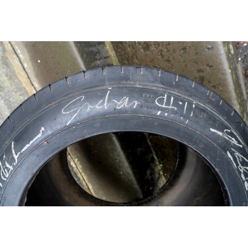 41 - GOOD-YEAR RACING TYRE, SIGNED BY JIM CLARK, GRAHAM HILL AND JACK BRABHAMThree World Motor Racing Cha... 