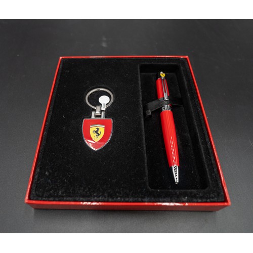 96 - FERRARI KEYRING AND PEN, BOXEDWith tag and care guide.