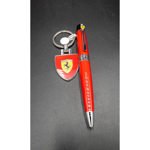 96 - FERRARI KEYRING AND PEN, BOXEDWith tag and care guide.