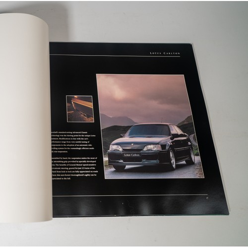 107 - LOTUS CARLTON BOXED HANDBOOK & BROCHUREHardbacked with rivetted covers, in original card packing... 