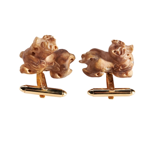 252 - PAIR OF GREEN/BROWN HAN DYNASTY JADE CUFF LINKS carved as mythical beasts. Mounted in 18k yellow gol... 