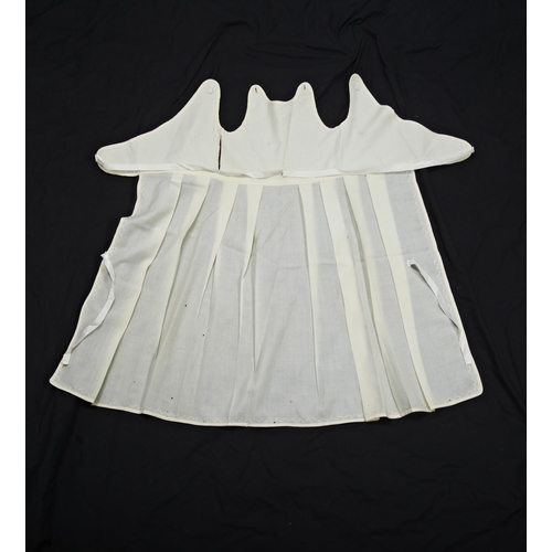 399 - A NINETEENTH CENTURY CHILD'S PINAFORE;the cream coloured cotton with embroidery and pleated skirt.me... 