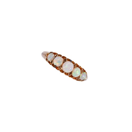 340 - A LATE VICTORIAN OPAL AND 18CT GOLD RINGthe five graduating cabochon-cut opals, claw set above taper... 