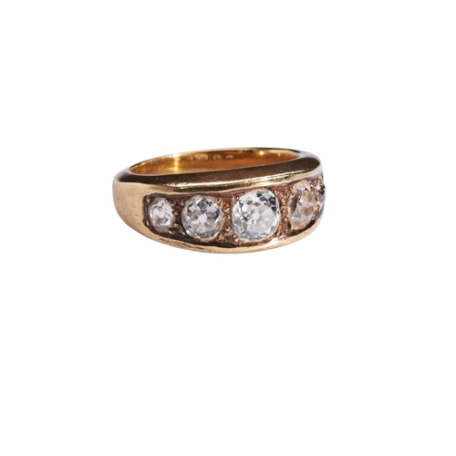 232 - A LATE VICTORIAN FIVE STONE DIAMOND AND GOLD RINGthe five graduating old brilliant-cut diamonds, wit... 