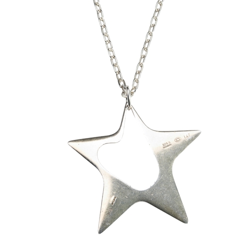 357 - A GEORGE JENSEN SILVER STAR PENDANT, on a silver chainDesigned by Henning Koppel, 1972Hallmarked 'GL... 