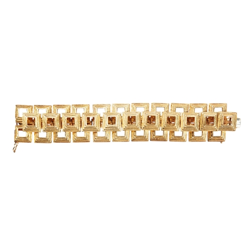 303 - A 1970'S BRACELETcomposed of eleven pairs of stepped square links with a single row of similar links... 