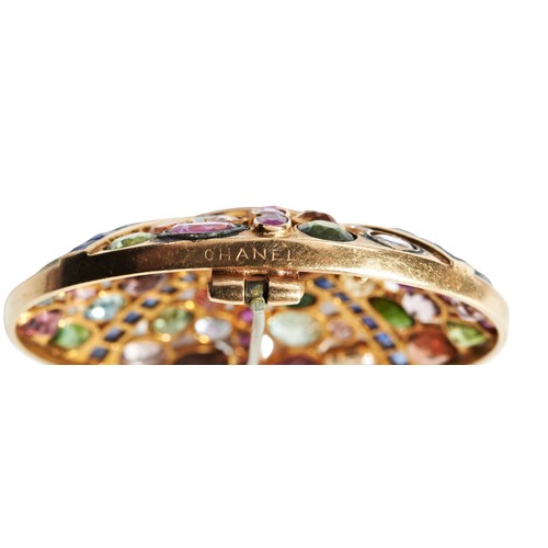 364 - CHANEL; A MULTI GEM SET BROOCHthe central circular cabochon-cut amethyst with four rows of radiating... 