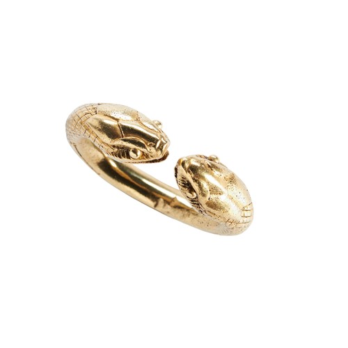 213 - AFTER THE ANTIQUE, A GOLD SNAKE RINGthe torque style ring with two snake terminals, with textured sh... 