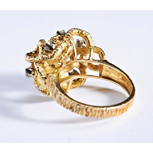 359 - ALAN GAURD; A DIAMOND AND GOLD RING, CIRCA 1970composed of a series of raised textured bark effect l... 