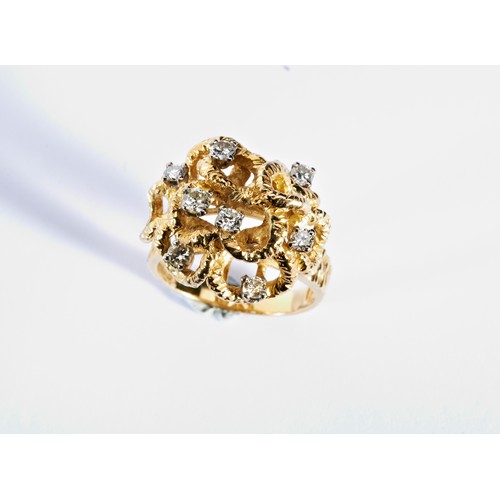 359 - ALAN GAURD; A DIAMOND AND GOLD RING, CIRCA 1970composed of a series of raised textured bark effect l... 