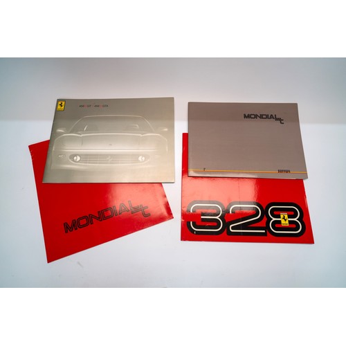 141 - A COLLECTION OF FERRARI MERCHANDISE - PIN BADGES, STICKERS, BROCHURESBrochures covering the 328, 348... 