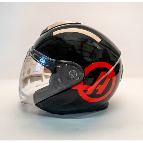 121 - A 'HAAS' F1 SCHUBERTH PIT CREW HELMETA Haas F1 Schuberth Pit Crew Helmet with Haas FI decal, black f... 