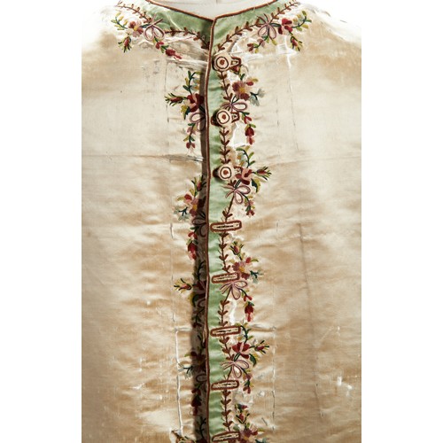 409 - A PAIR OF GENTLEMAN'S WAISTCOAT PANELS;un-mounted, the silk ground with floral embroidery (distresse... 