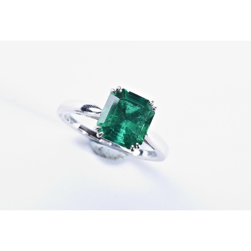 365 - COLUMBIAN TREATED EMERALD RINGthe step-cut cut cornered treated emerald four double claw set, betwee... 