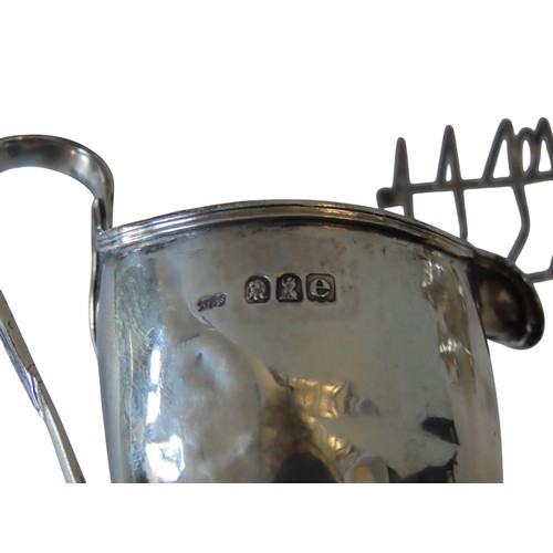 344 - A PAIR OF VICTORIAN SILVER PEPPERETTES AND HELMET FORM CREAMER, the fluted waisted peperettes marked... 