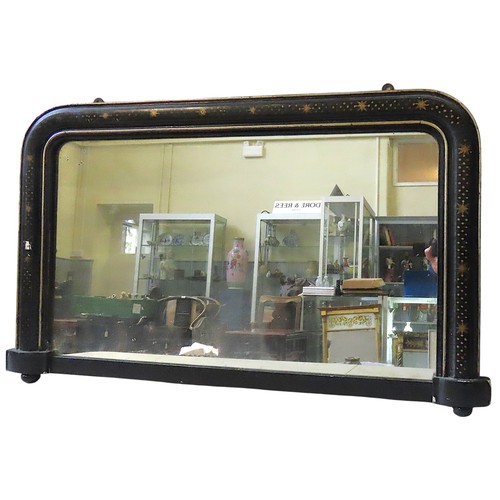 84 - A 19TH CENTURY EBONISED OVERMANTEL MIRROR, the arch form overmantel with gilt painted star decoratio... 