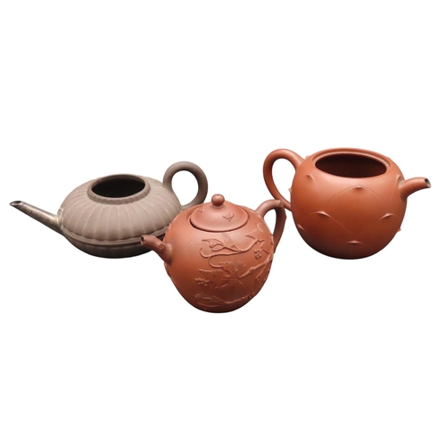 219 - THREE CHINESE YIXING TEAPOTS, the lot comprising of a compressed lobed teapot with replaced spout, a... 