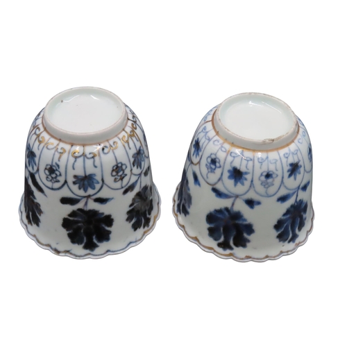 218 - A PAIR OF ARITA WARE BLUE AND WHITE BEAKERS, 19TH CENTURY, with undulating scalloped rims, the sides... 