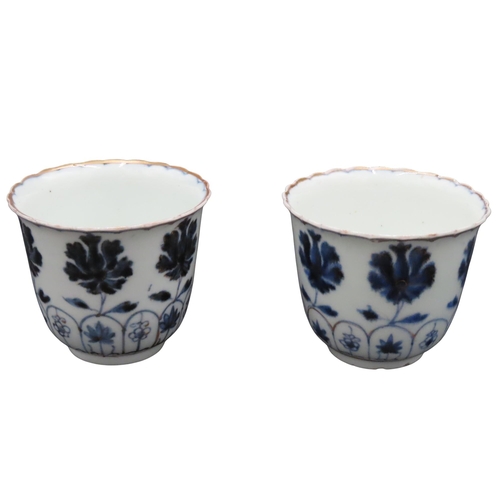 218 - A PAIR OF ARITA WARE BLUE AND WHITE BEAKERS, 19TH CENTURY, with undulating scalloped rims, the sides... 