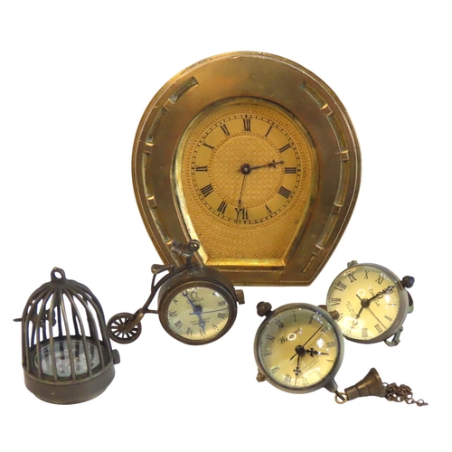 106 - A VINTAGE BRASS HORSESHOE CLOCK, TWO MINIATURE BALL CLOCKS AND TWO NOVELTY MINIATURE CLOCKS, the nov... 