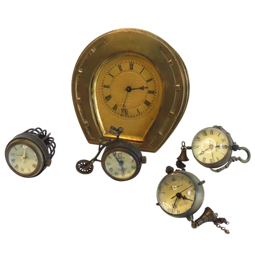 106 - A VINTAGE BRASS HORSESHOE CLOCK, TWO MINIATURE BALL CLOCKS AND TWO NOVELTY MINIATURE CLOCKS, the nov... 