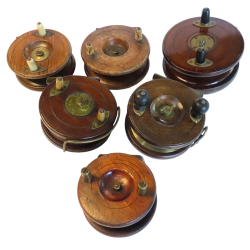 438 - A HEATON'S VINTAGE FISHING REEL AND FIVE OTHERS, various sizes, all wooden with brass mounts12.5 cm ... 