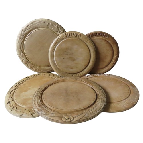 429 - SIX VINTAGE BREAD BOARDS, circular and oval form, three with foliate carved borders, the others insc... 