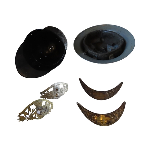 143 - A WWII FIREARMS/ARP HELMET another helmet, two French Fireman's helmet plaques and two French WW1 Br... 